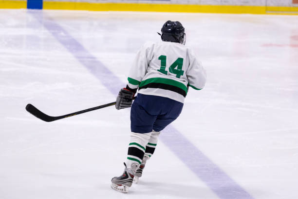 Mature woman playing hockey