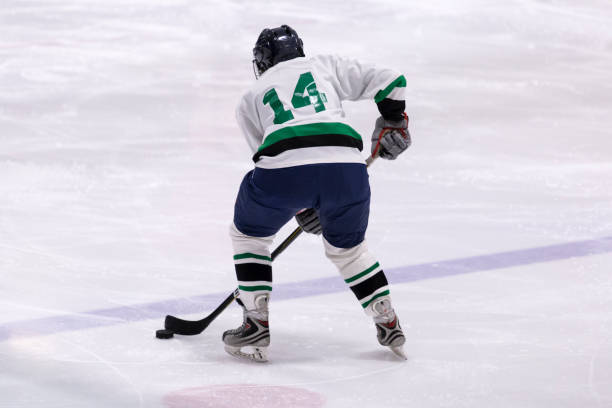 istock Mature woman playing hockey 1145906107