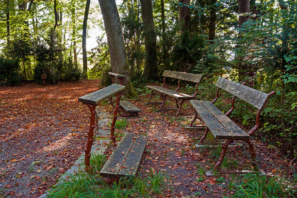 benches to pray and kneel on Calvary in the forest, Germany kneelers stock pictures, royalty-free photos & images