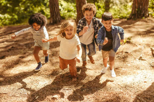 istock Kids running up in the forest 1145907080