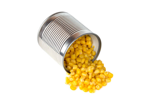 istock Canned corn on a white background. Corn closeup in an iron jar on a white background. 1145910151