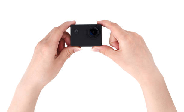 istock Action camera on a white background. Black portable camera closeup in hands on a white background. 1145910176