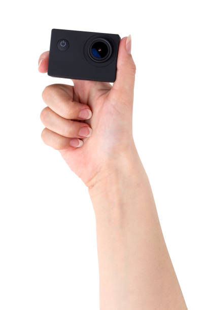 istock Action camera on a white background. Black portable camera closeup in hand on a white background. 1145910431