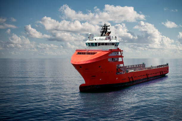 istock Offshore supply boat at sea during nice calm weather performing duties. Compositing technique. 1145915996