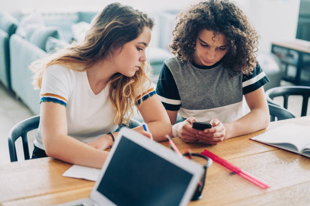 istock Teenagers with smart phones learning 1145916405