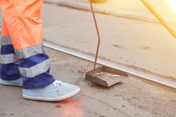 istock Cleaner scavenges cigarette butts in the streets 1145917757