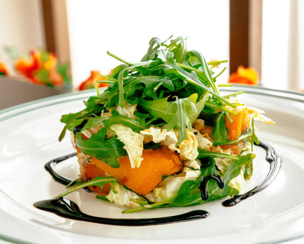 Fresh cabbage salad and orange, healthy food.