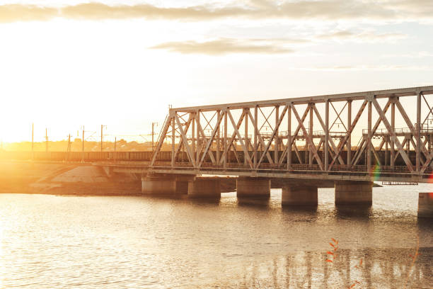 istock Sunset above railway bridge over water reservoir 1145919523