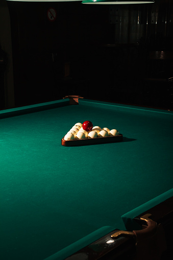 Billards pool game. Green cloth table with white balls.