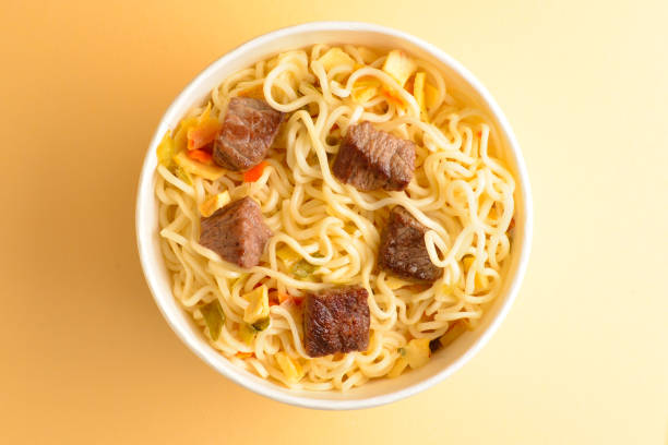 istock Paper cup with instant ramen noodles with beef and vegetables. 1145919865