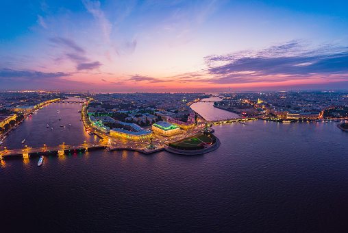 Beautiful aerial evning view in the white nights of St. Petersburg, Russia, The Vasilievskiy Island at sunset, Rostral Columns, Admiralty, Palace Bridge, Stock Exchange Building. shot from drone.
