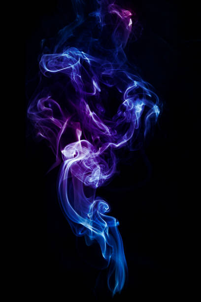 istock Colorful smoke on dark background 1145921252