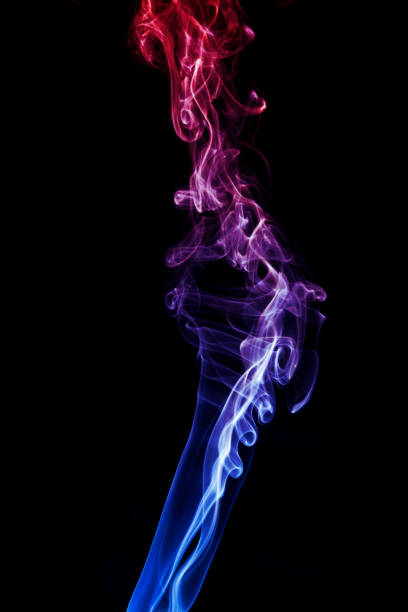 istock Colorful smoke on dark background 1145921253