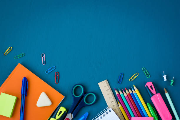 istock School supplies on blue background 1145925624