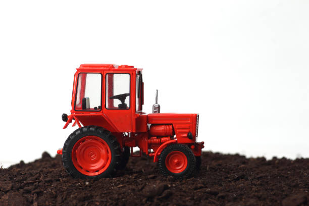 istock Red tractor T-25 A in the field 1145927042