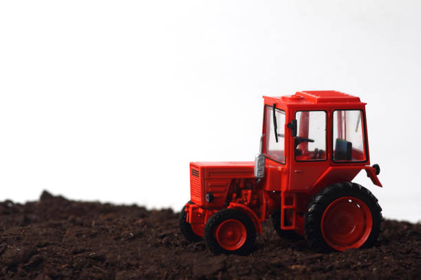 istock Red tractor T-25 A in the field 1145927071
