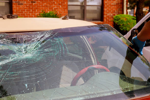 istock Automobile special workers remove broken windscreen or windshield of a car in auto service station 1145933847