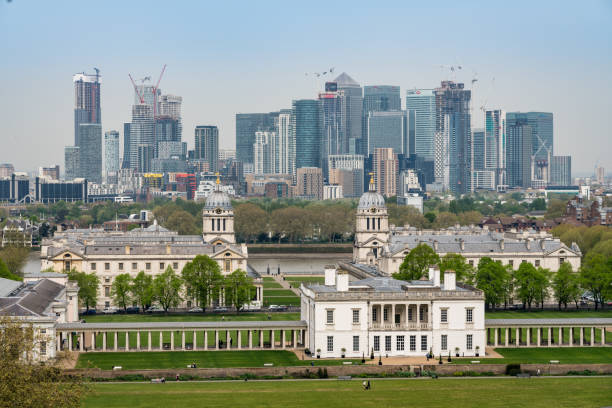 Queens House in Greenwich with Canary Wharf LONDON, UK - 23 APRIL 2019: Queen's House in Greenwich with Canary Wharf financial district in background queen's house stock pictures, royalty-free photos & images