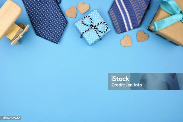 Fathers Day Top Border Of Gifts Ties And Hearts On A Blue Background Stock Photo - Download Image Now