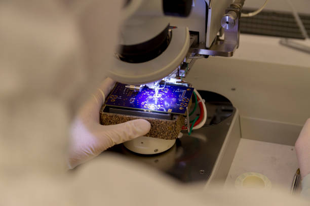istock Wire Bonder Used for Attaching Silicon Chips and Electronic Devices to a PCB Printed Circuit Board 1145936994