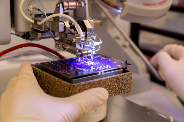 istock Wire Bonder Used for Attaching Silicon Chips and Electronic Devices to a PCB Printed Circuit Board 1145937007