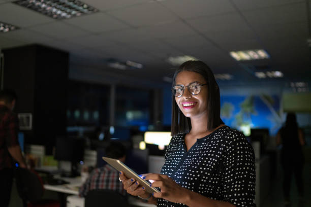 istock Happy businesswoman using digital tablet in the office ate night 1145937841