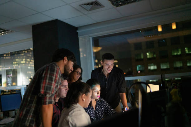 istock Dedicated team reunited working late at office 1145938658