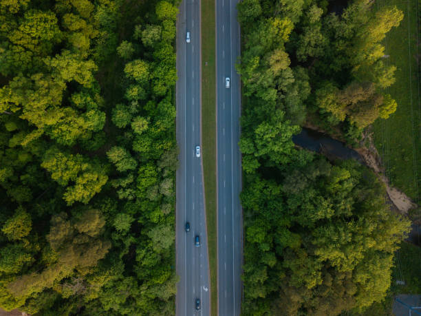istock Aerial of Highway through Forest in the Spring 1145939518
