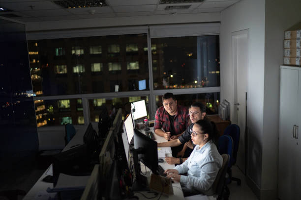 istock Dedicated team reunited working late at office 1145939521