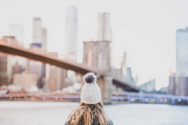 young woman traveling through new york city usa - coat warm clothing one person joy imagens e fotografias de stock