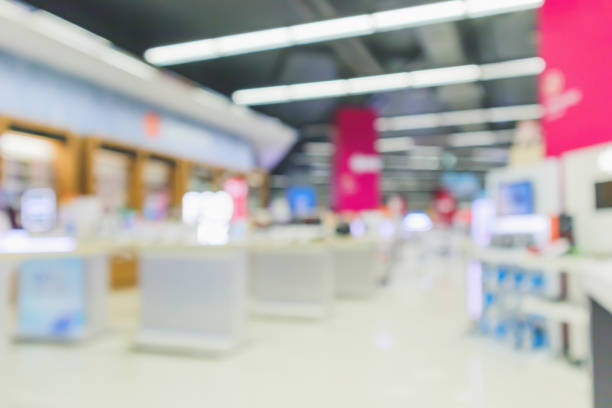 istock mobile phone in electronic store interior with customer abstract blurred background 1145945168