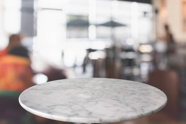 istock round marble table top with cafe restaurant bokeh lights abstract background for montage product display 1145945709