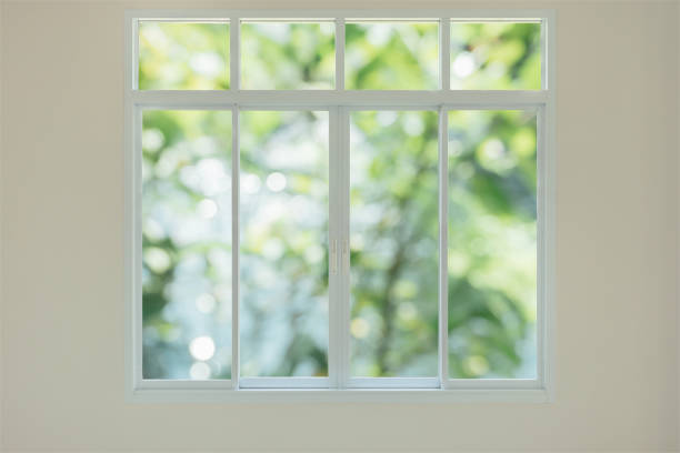 istock Modern house window with green garden view bokeh background 1145945712