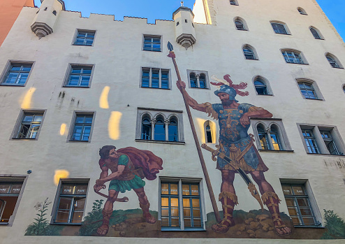 Regensburg/Germany - October 12, 2018: Painting of the fight between David and Goliath. This is one of the landmarks of the UNESCO World Heritage City of Regensburg.