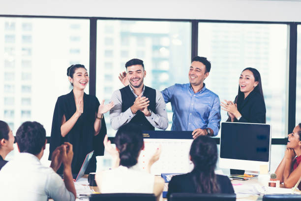 istock Creative friendly smiling businessmen having conversation sitting together at meeting, cheerful caucasian male executive discuss work in office with multi-ethnic subordinates 1145950809