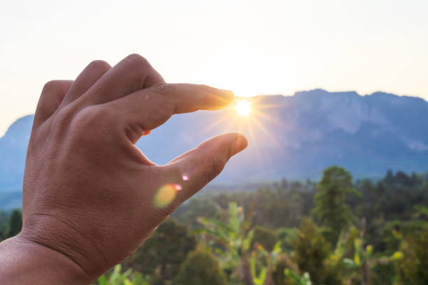 istock Silhouette of man hands during sunset. 1145951730