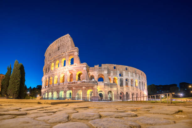 night view of colosseum in rome, italy. rome architecture and landmark. rome colosseum is one of the main attractions of rome and italy - flavian imagens e fotografias de stock