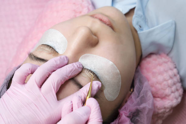 istock Eyelash Extension Procedure. Woman Eye with Long Eyelashes 1145954485