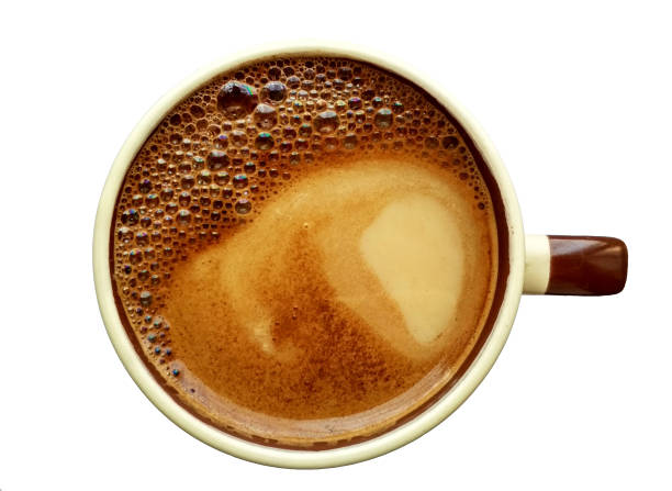 istock Coffee with milk in a ceramic mug with rainbow foam on the top. 1145954583