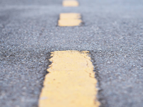 istock yellow line on the asphalt street 1145955262