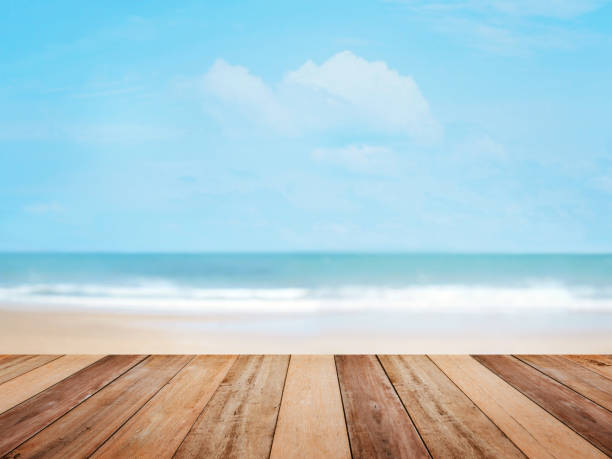 istock Wood table top over summer beach 1145956247