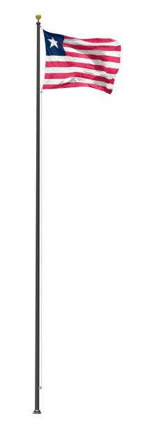 istock Liberia flag flying on a tall flagpole, isolated on a white background 1145961317