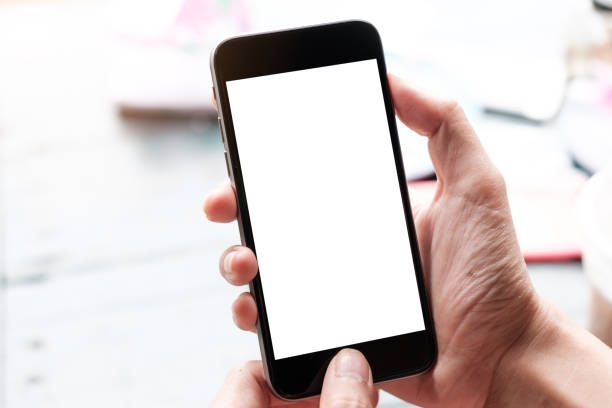 istock Man and mobile smartphone with blank screen on blur background 1145963409