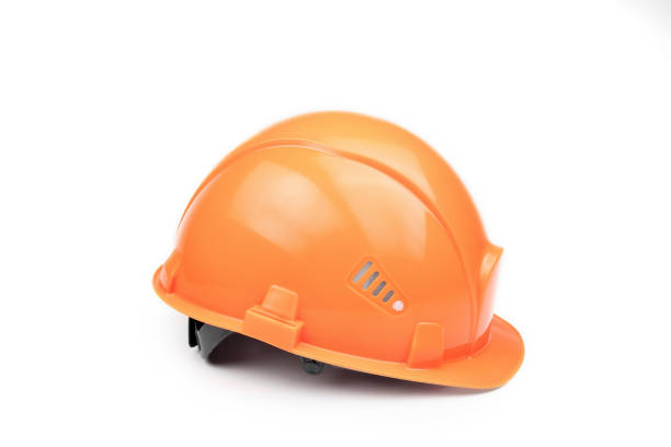 istock Orange construction helmet on a light background. The concept of architecture, construction, engineering, design. Copy space. 1145966537