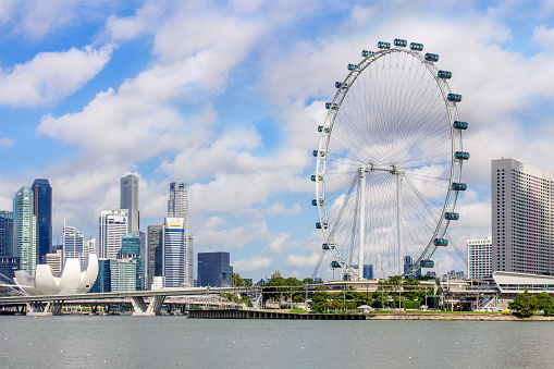 Landscape of the Singapore city financial district with Marina Bay ang Singapore Flyer on an sunny day
