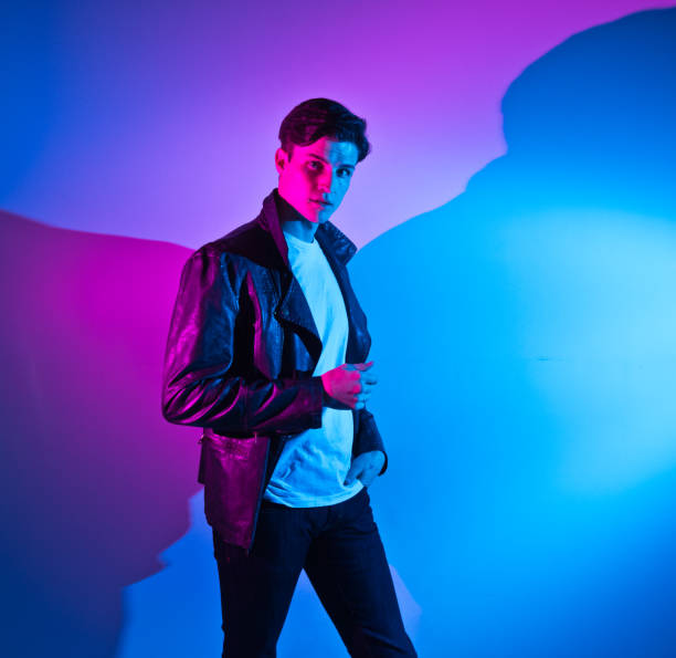 istock Handsome young man in colorful environment 1145969910
