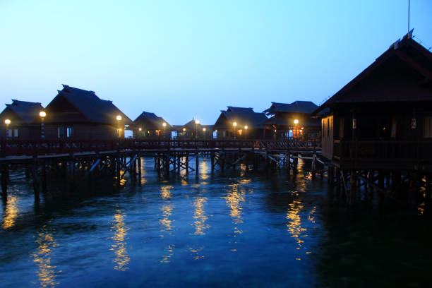 istock huts in the sea at night 1145969958