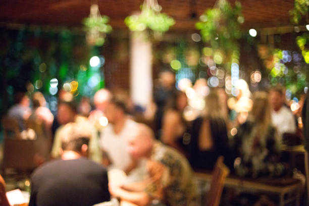 istock Blurred background of many people had fun at a beach party. 1145971861