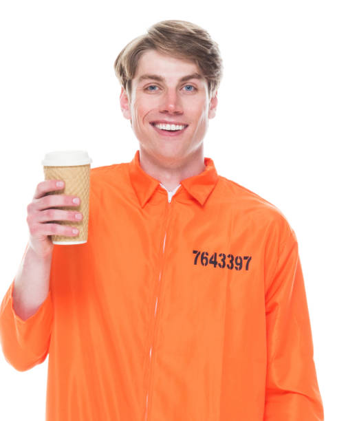 istock Male prisoner wearing orange jumpsuit 1145971912