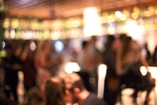 istock Blurred background of many people had fun at a beach party. 1145971946